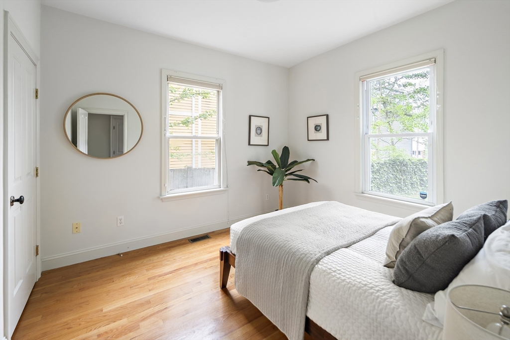 28 Summer Street, Unit 1 Somerville, MA 02143 - Photo 9 of 14 a bedroom with a bed and a window