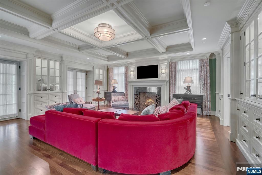 480 Knollwood Road Ridgewood, NJ 07450 - Photo 13 of 50 a living room with furniture and a fireplace
