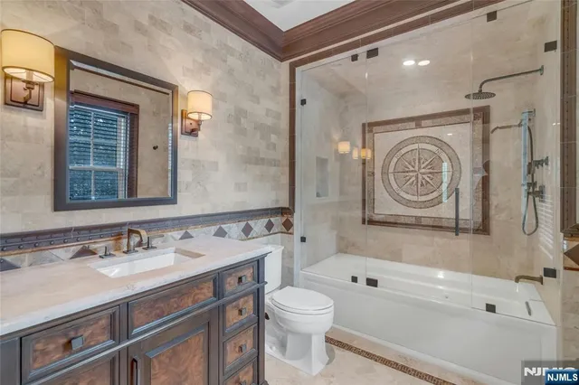 a bathroom with a sink a toilet and a bathtub