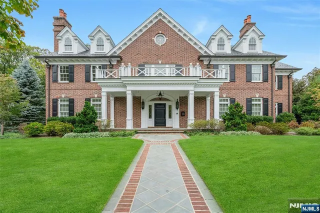 a front view of a house with yard