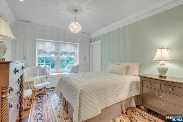 a bed room with a bed and a window