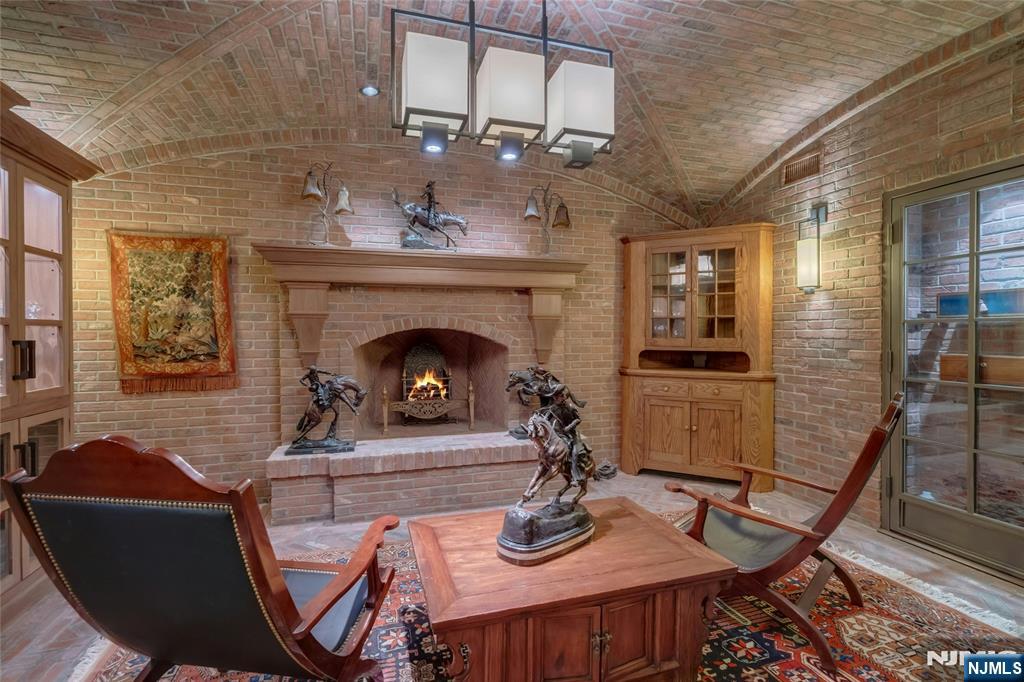 480 Knollwood Road Ridgewood, NJ 07450 - Photo 31 of 50 a living room with furniture and a fireplace