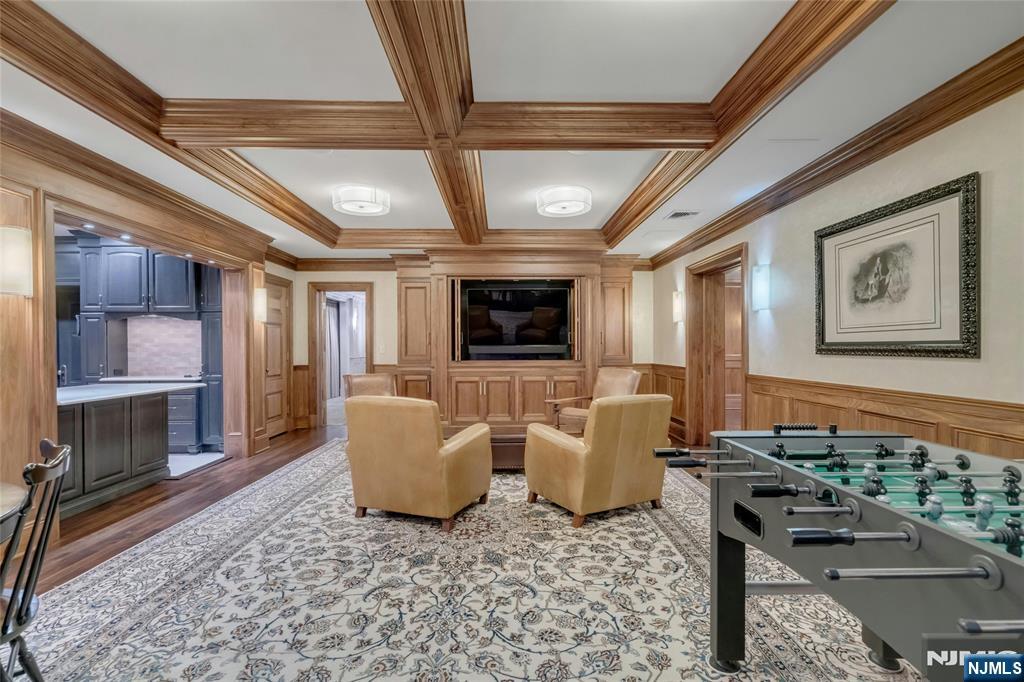 480 Knollwood Road Ridgewood, NJ 07450 - Photo 34 of 50 a living room with furniture and a flat screen tv