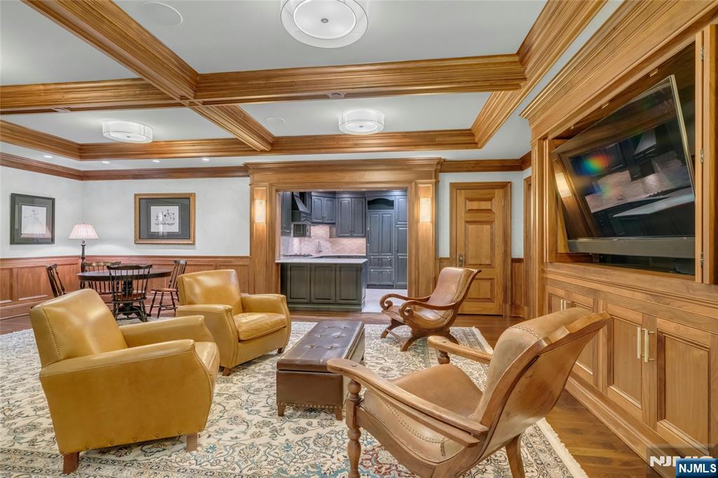 480 Knollwood Road Ridgewood, NJ 07450 - Photo 35 of 50 a living room with furniture and a flat screen tv