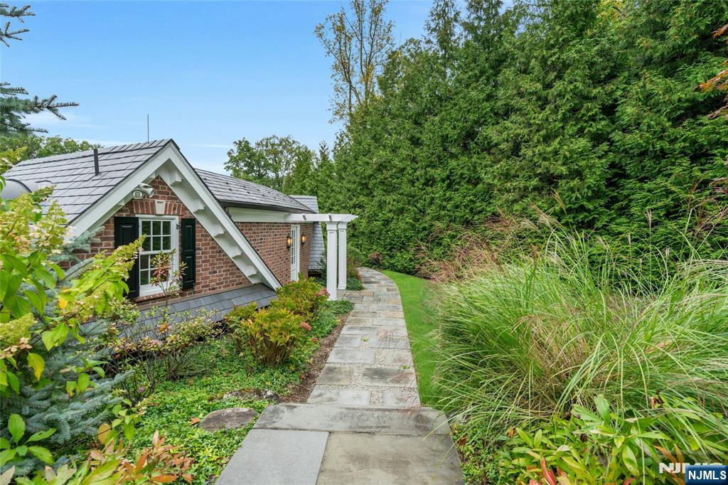 480 Knollwood Road Ridgewood, NJ 07450 - Photo 41 of 50 a view of a pathway of a house with a small yard