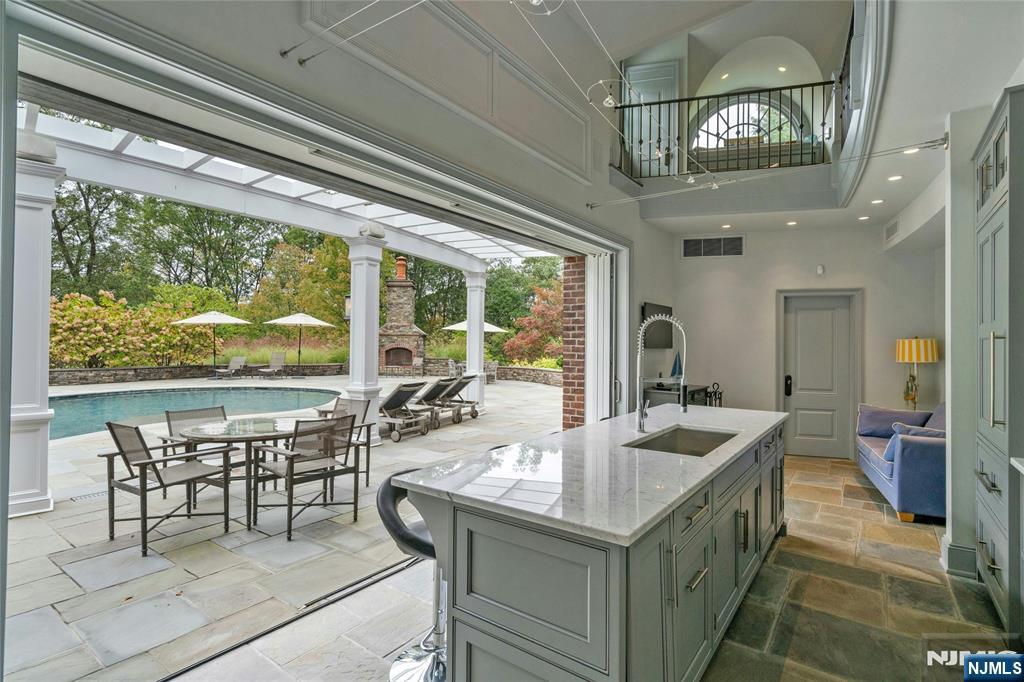 480 Knollwood Road Ridgewood, NJ 07450 - Photo 44 of 50 a view of a dining room with furniture large window and chandelier
