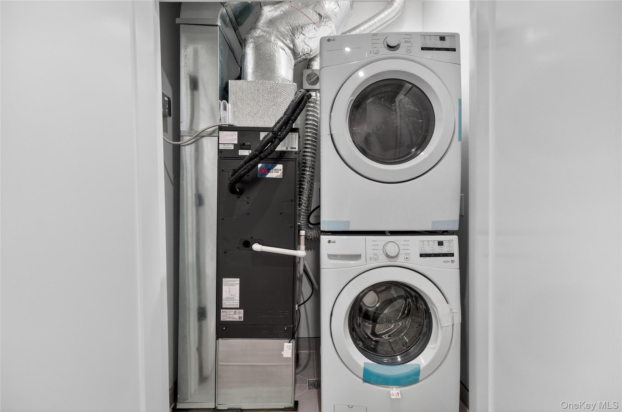 10 Market Street, Unit G Wappingers Falls, NY 12590 - Photo 12 of 20 a utility room with dryer and washer