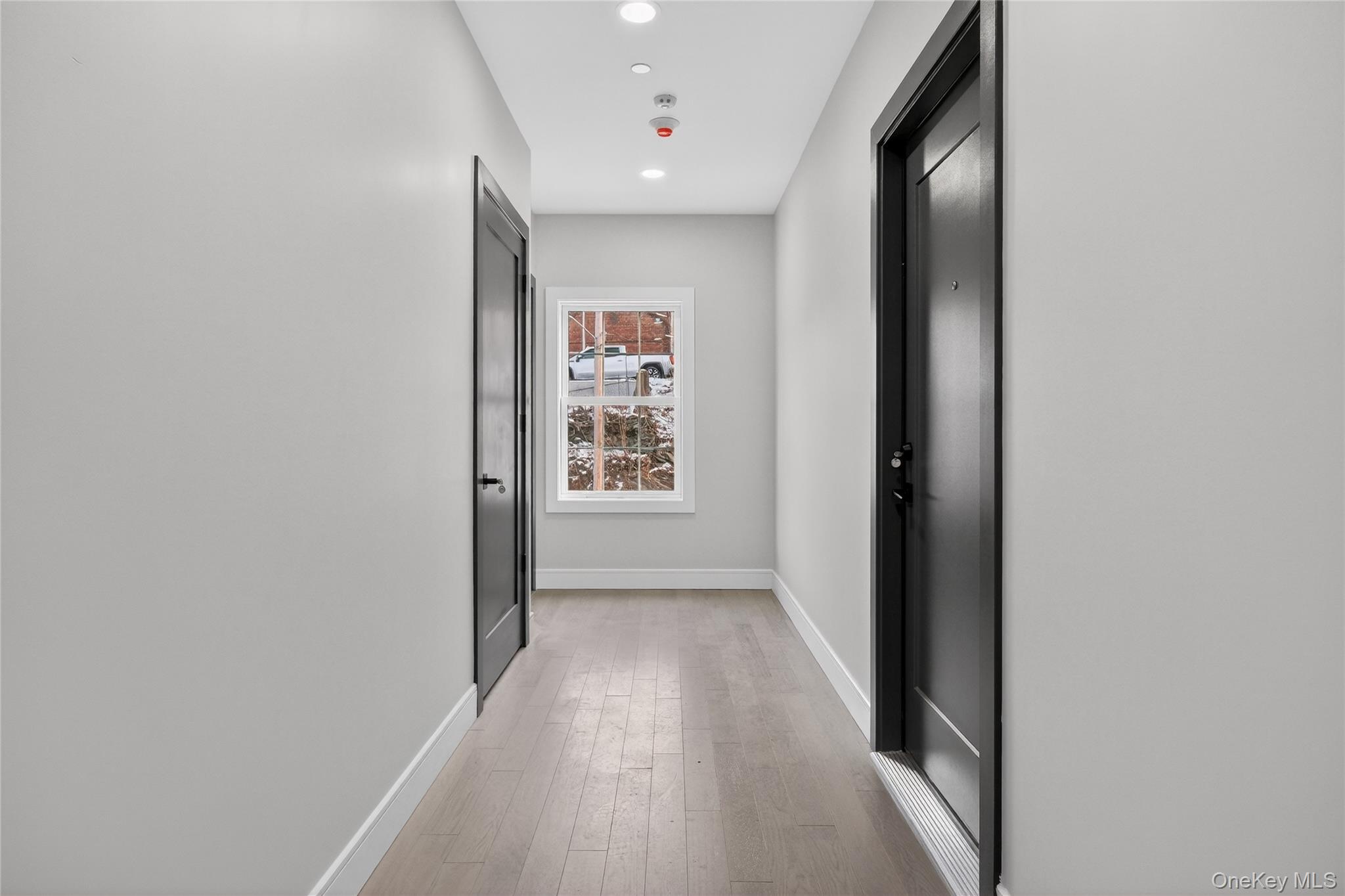 10 Market Street, Unit G Wappingers Falls, NY 12590 - Photo 18 of 20 a view of a hallway with wooden floor