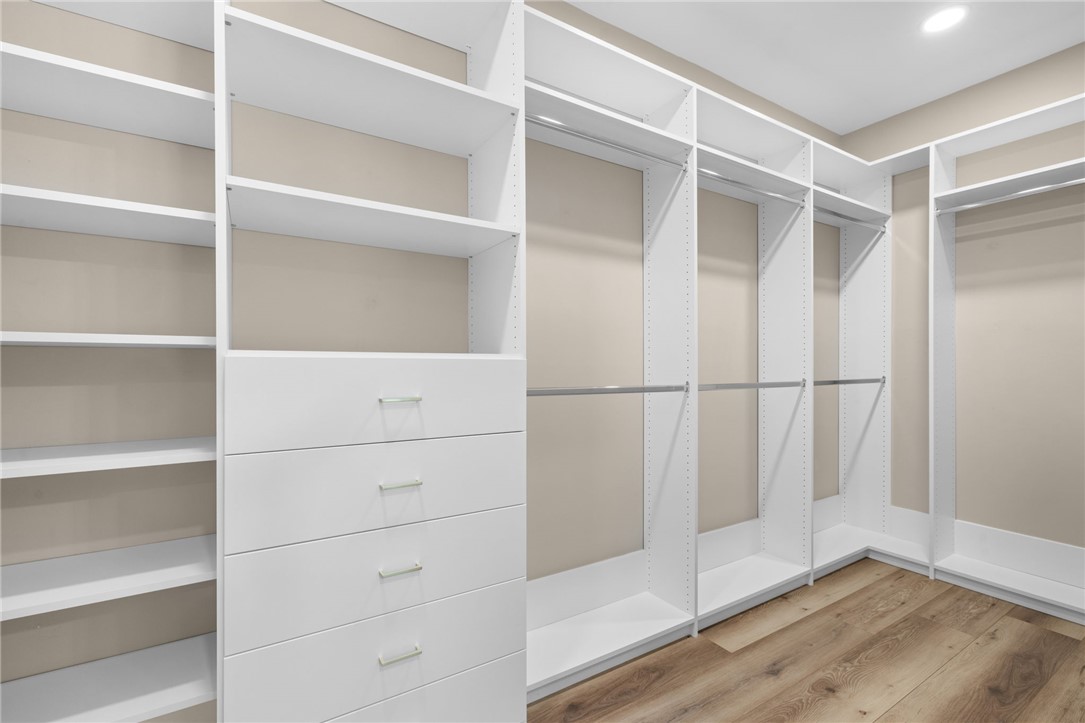 147 McAlister Road West Union, SC 29696 - Photo 18 of 50 Custom built-in shelving and ample hanging rods maximize organization in this spacious closet.