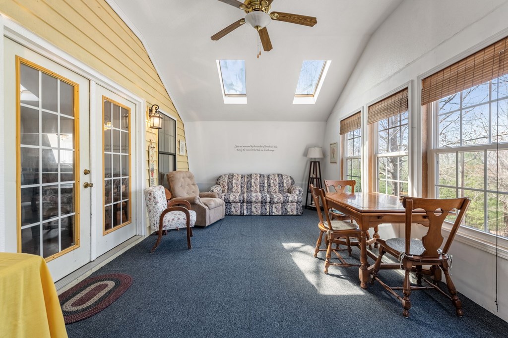 1262 Maple Grove Road Morganton, GA 30560 - Photo 22 of 68 a view of a livingroom with furniture and a ceiling fan