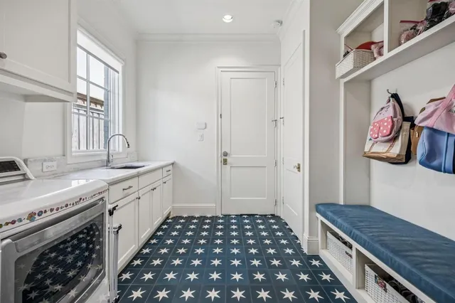 a kitchen with granite countertop a stove and a sink