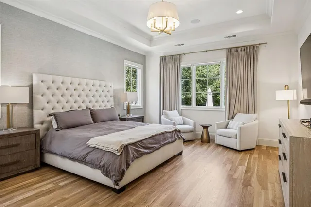 a bedroom with a bed and a couch