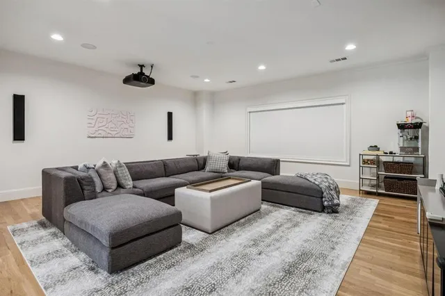 a living room with furniture and a rug