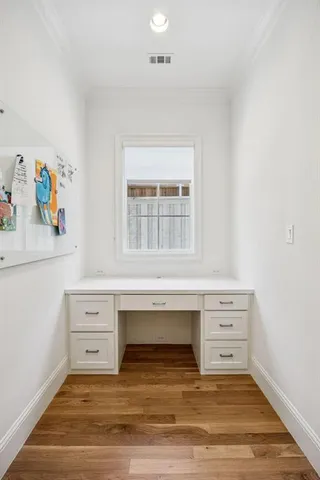 a view of cabinet and hardwood floor
