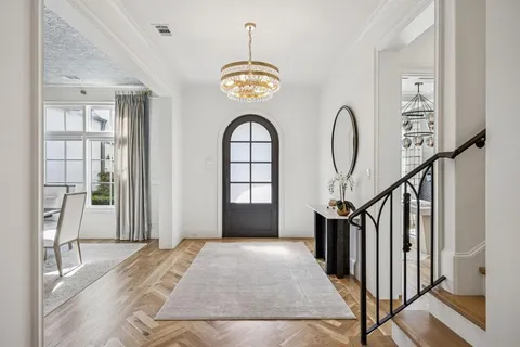 a view of an entryway with wooden floor