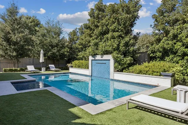 a view of a backyard with sitting area