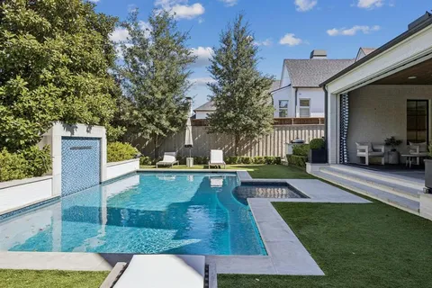 a view of a swimming pool with sitting area