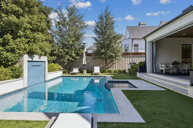 a view of a swimming pool with sitting area