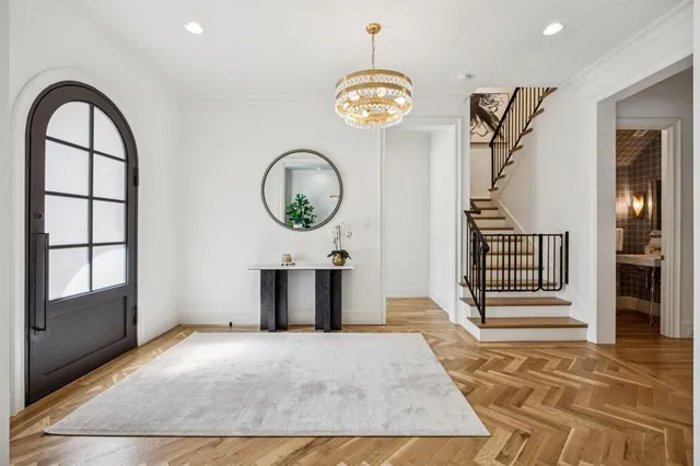 an empty room with a fireplace and windows
