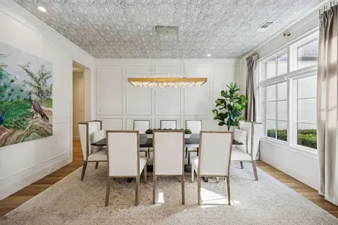 a view of a dining room with furniture and window