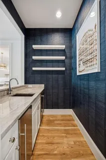 a bathroom with a granite countertop sink
