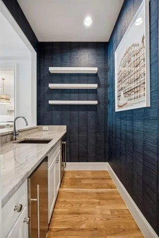 a bathroom with a granite countertop sink