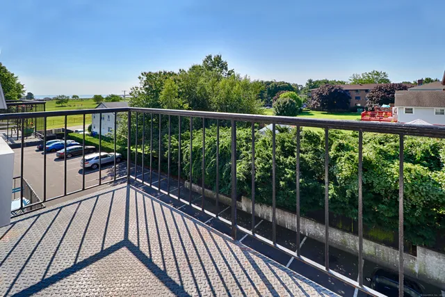 a view of a balcony with furniture
