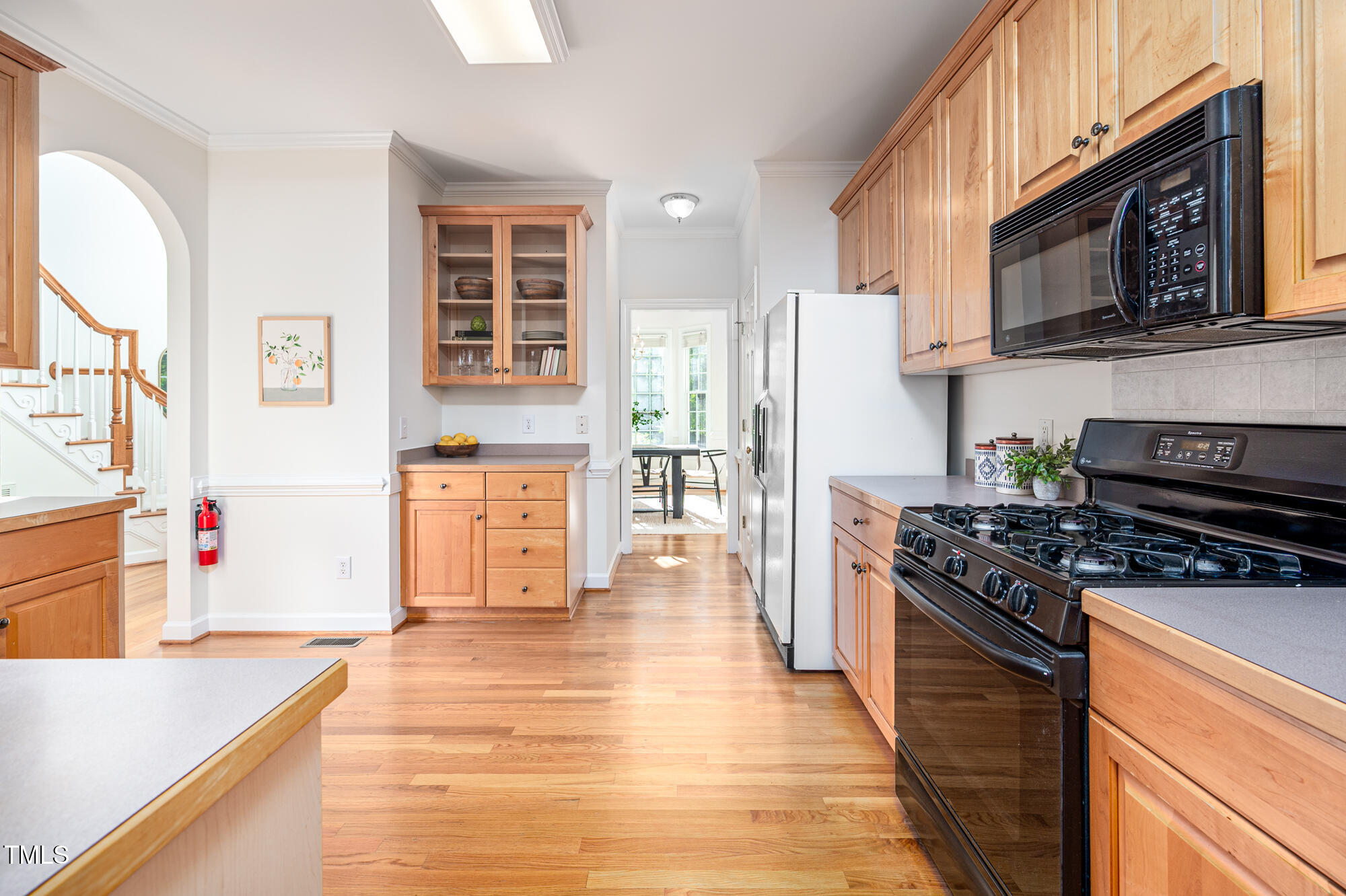 506 Manor Ridge Road Carrboro, NC 27510 - Photo 11 of 30 a kitchen with stainless steel appliances granite countertop a stove and a refrigerator