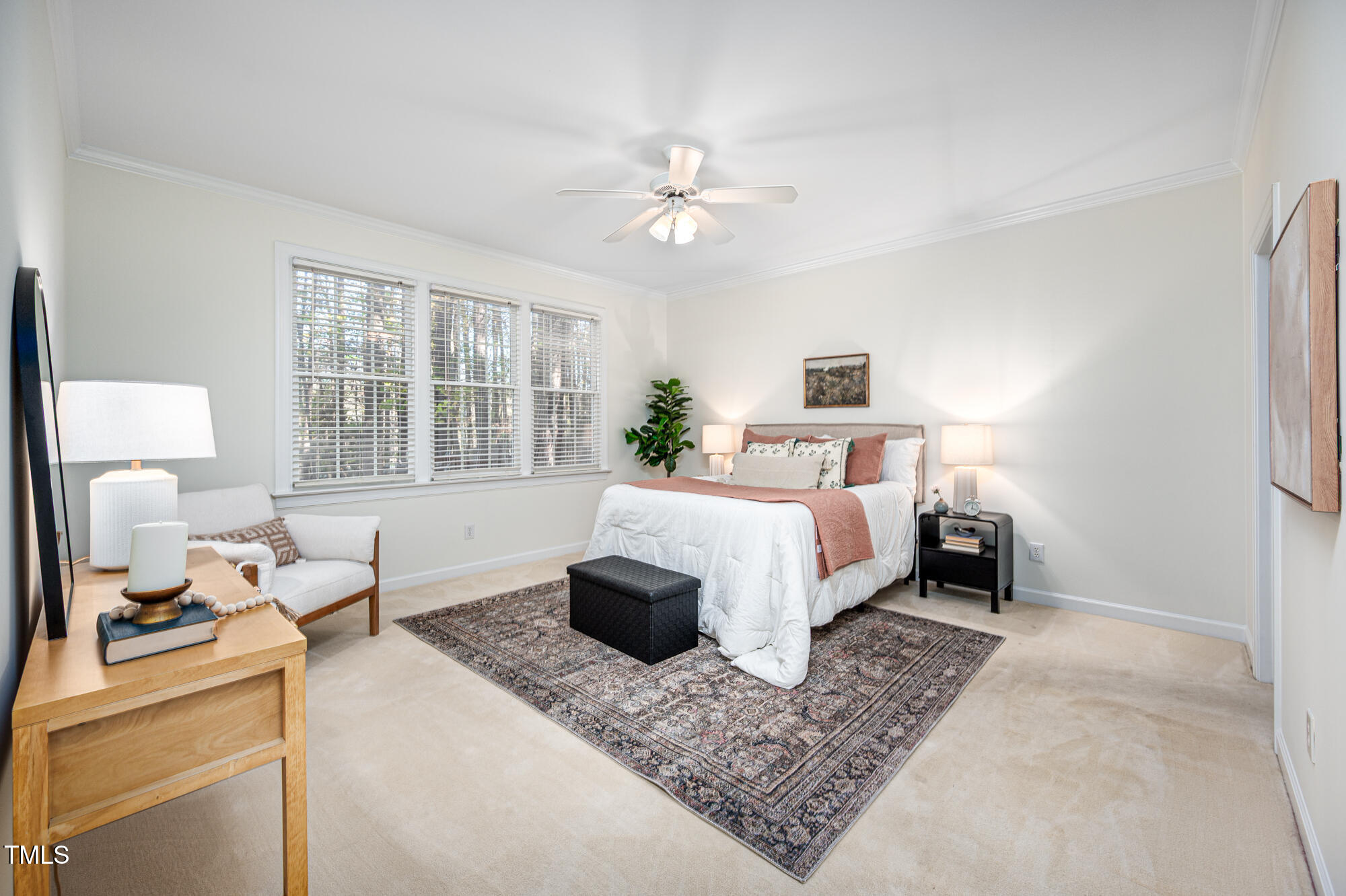 506 Manor Ridge Road Carrboro, NC 27510 - Photo 13 of 30 a bedroom with a large bed a chandelier and windows