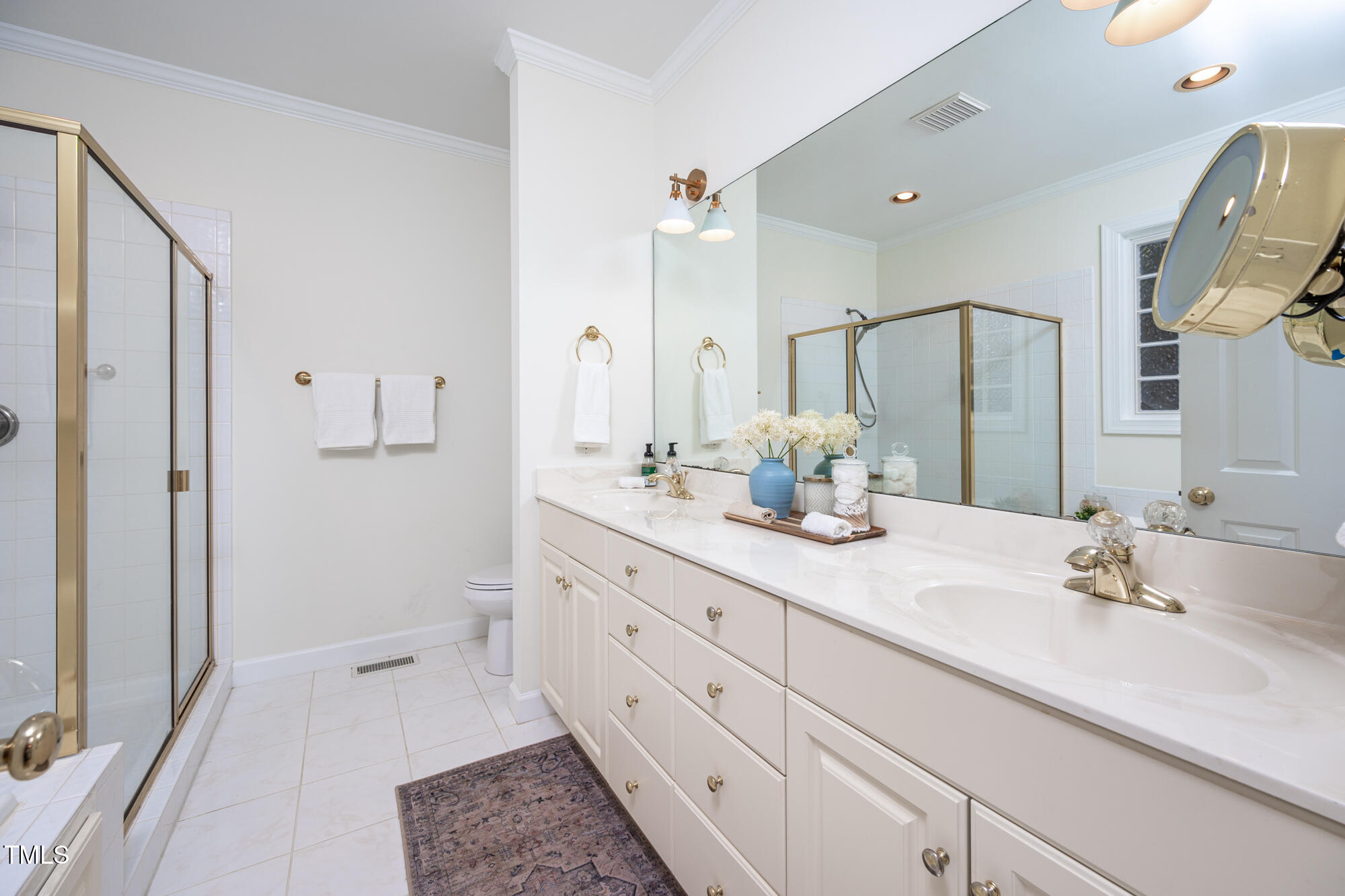 506 Manor Ridge Road Carrboro, NC 27510 - Photo 15 of 30 a bathroom with a double vanity sink mirror and shower