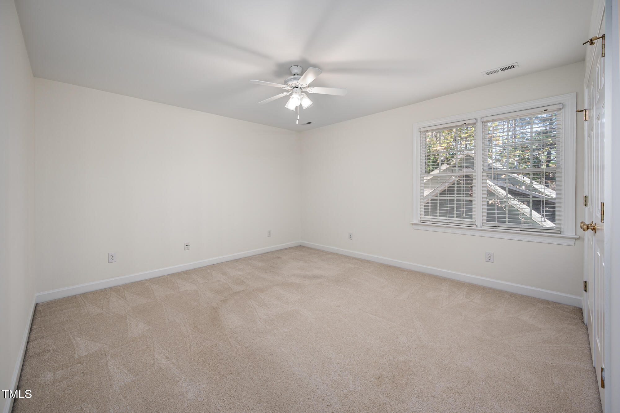 506 Manor Ridge Road Carrboro, NC 27510 - Photo 19 of 30 an empty room with a window and a fan