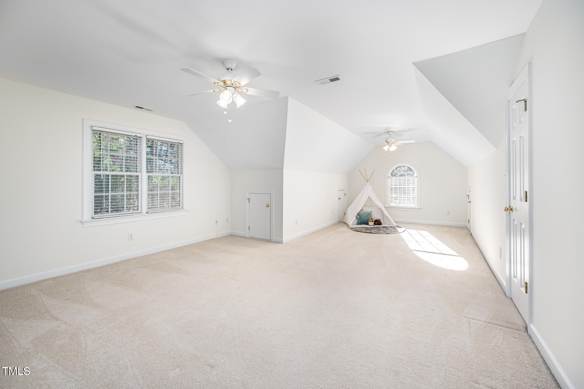 506 Manor Ridge Road Carrboro, NC 27510 - Photo 24 of 30 an empty room with windows and ceiling fan