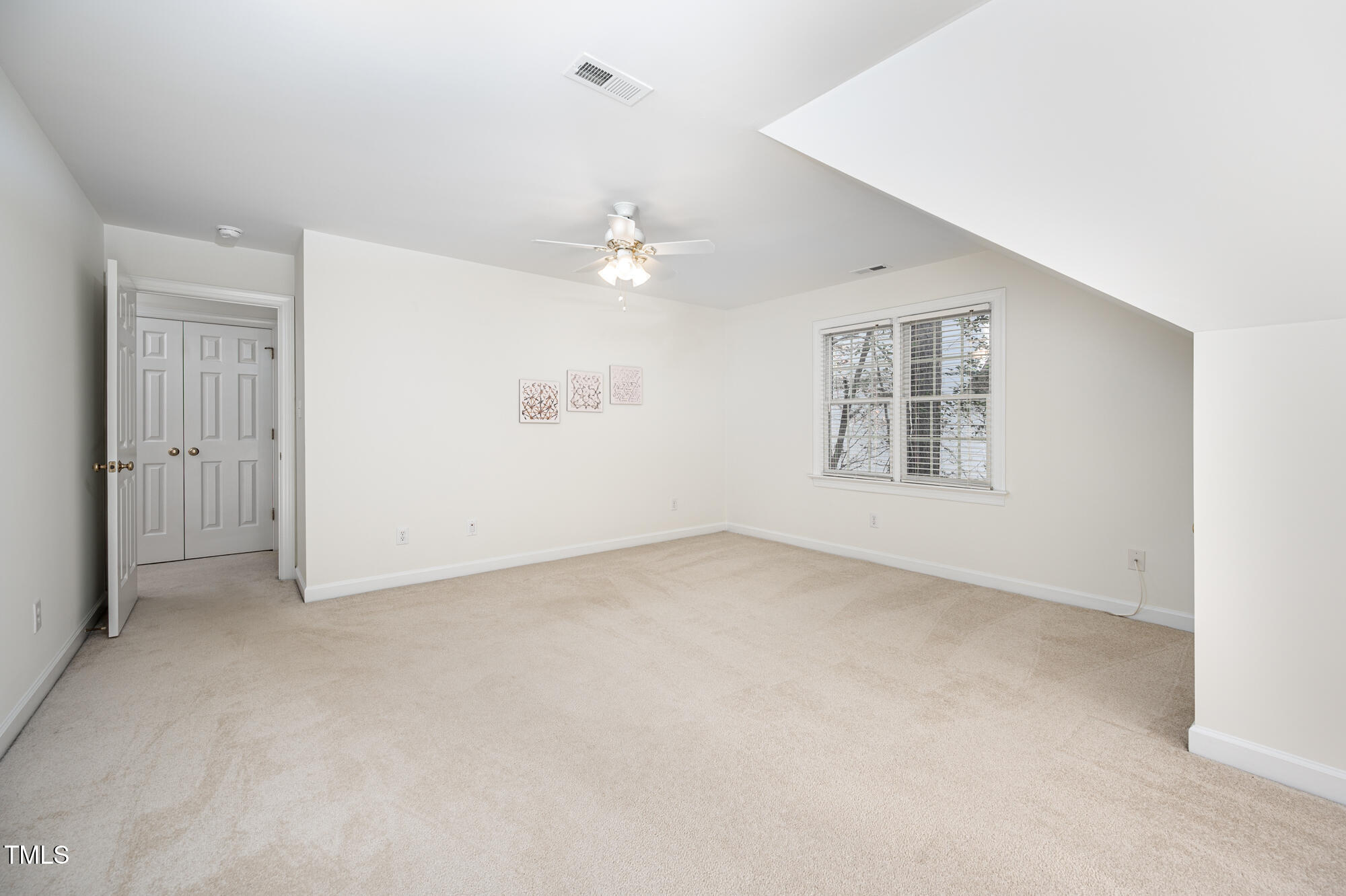506 Manor Ridge Road Carrboro, NC 27510 - Photo 25 of 30 an empty room with windows and ceiling fan