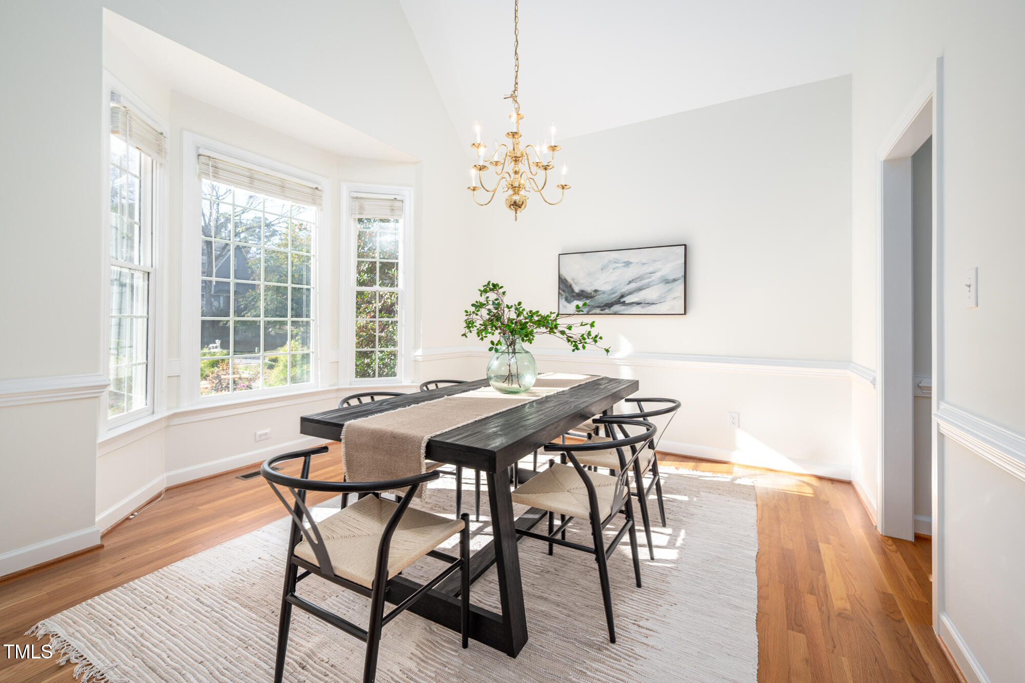 506 Manor Ridge Road Carrboro, NC 27510 - Photo 3 of 30 a view of a dining room with furniture and wooden floor