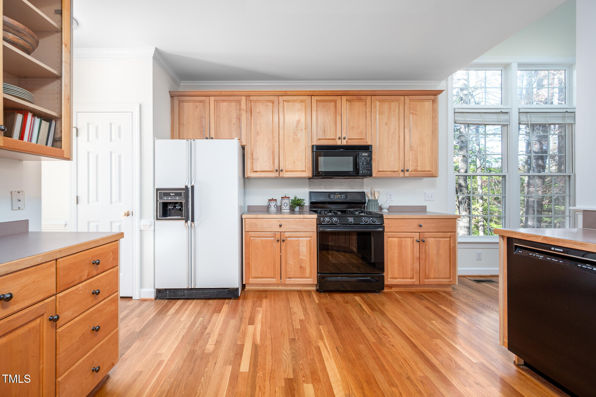 506 Manor Ridge Road Carrboro, NC 27510 - Photo 10 of 30 a kitchen with stainless steel appliances a stove a refrigerator a sink and a microwave