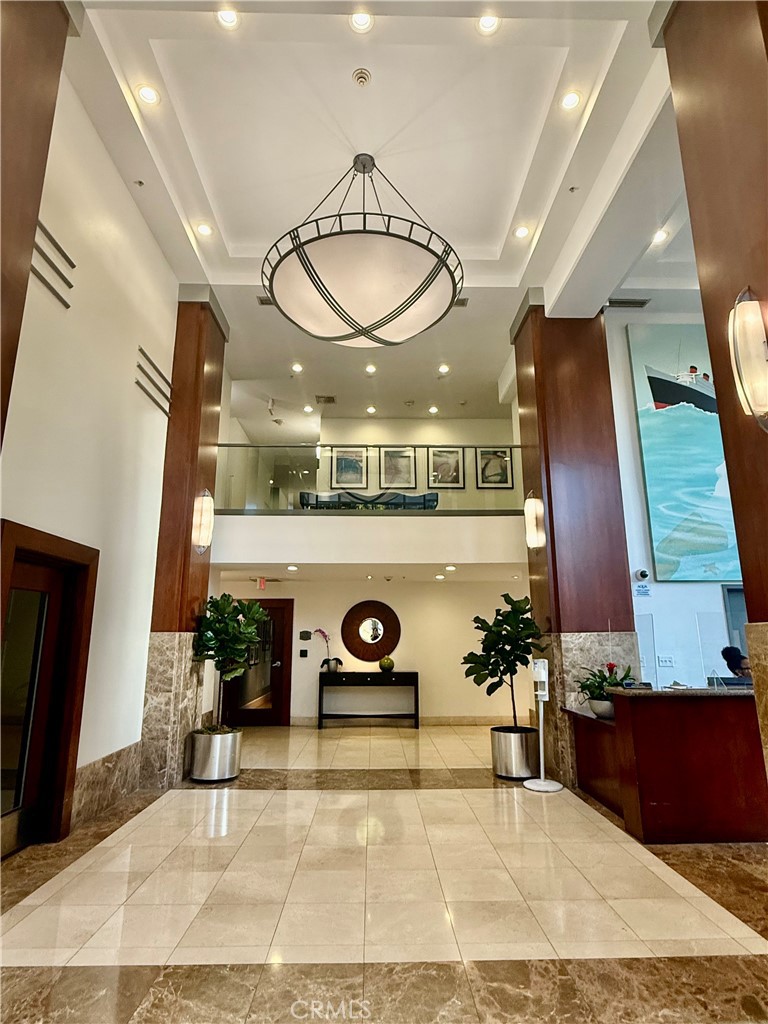 488 East Ocean Boulevard, Unit P2 Long Beach, CA 90802 - Photo 2 of 15 a living room with furniture a rug and white walls