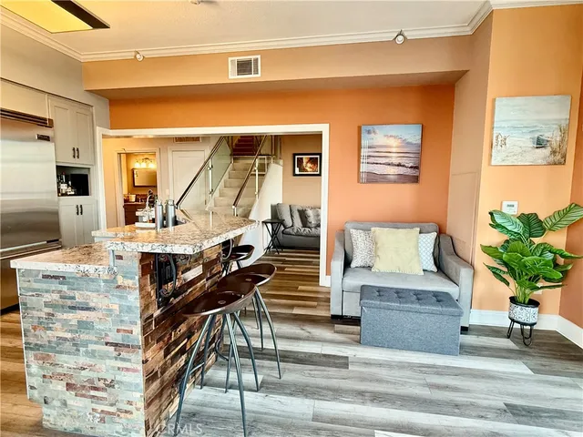 a large kitchen with lots of counter space and stainless steel appliances