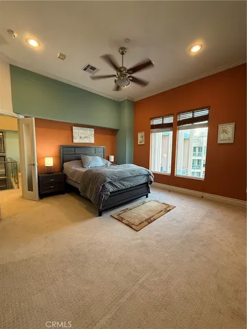 a room with table chairs and a ceiling fan