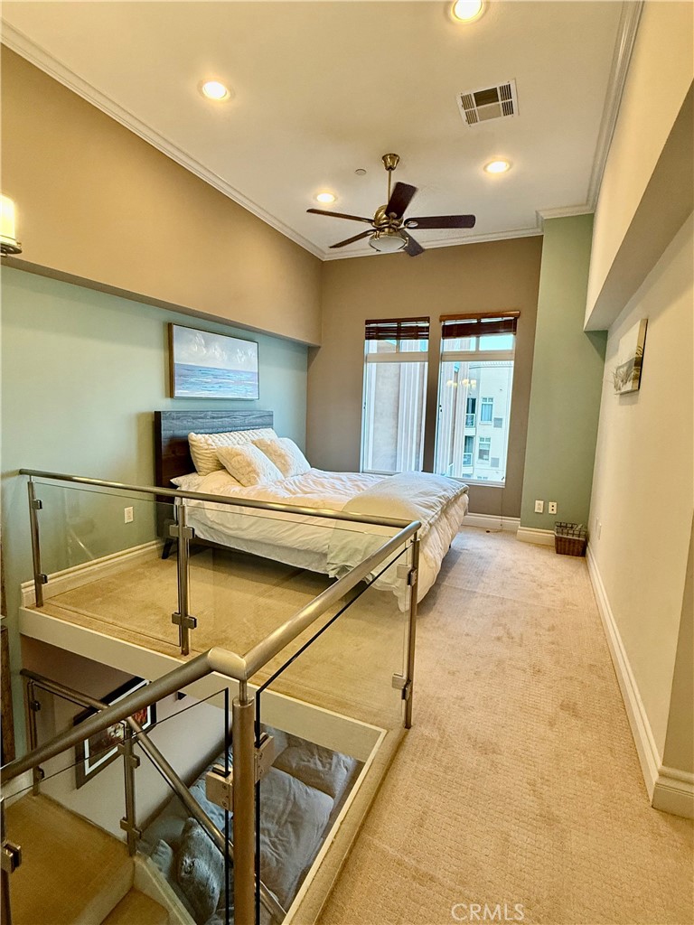 488 East Ocean Boulevard, Unit P2 Long Beach, CA 90802 - Photo 9 of 15 a room with table chairs and a ceiling fan