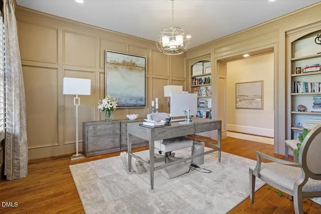 a spacious bedroom with a large bed and a large window