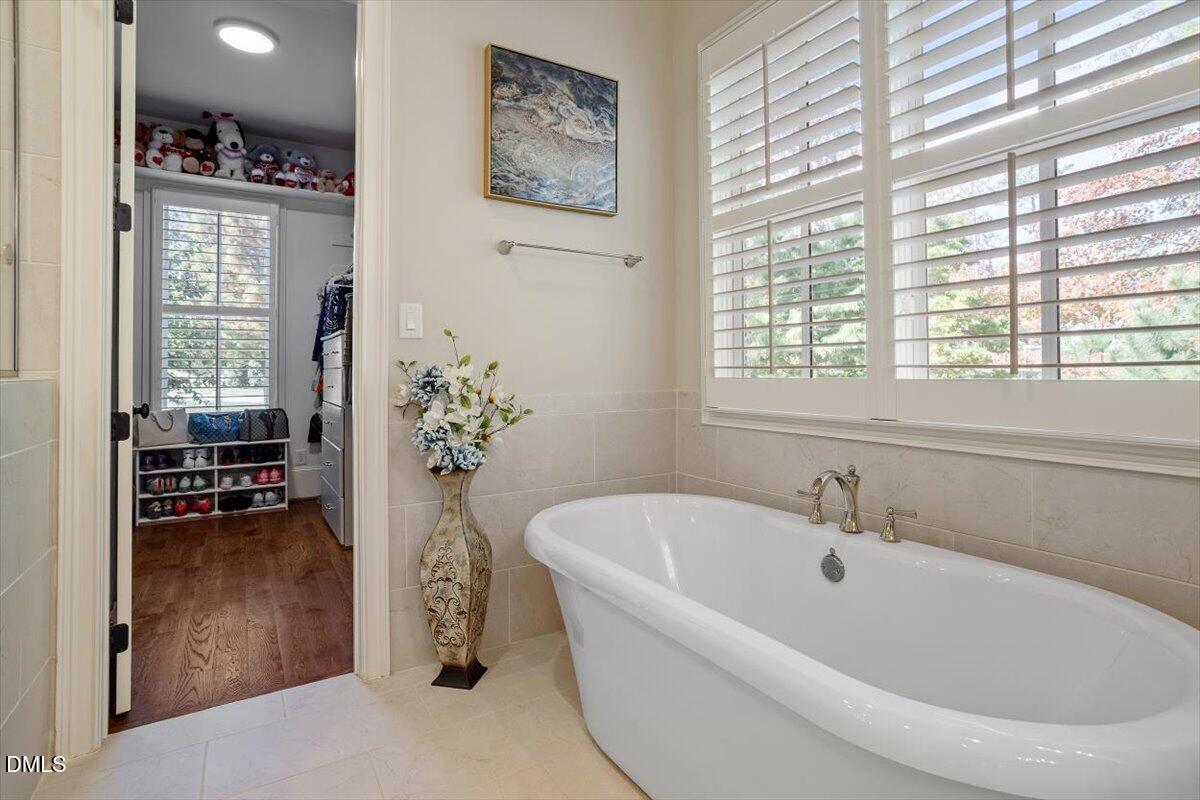 1413 Lily Estates Drive Raleigh, NC 27614 - Photo 22 of 82 a white bath tub sitting next to a window