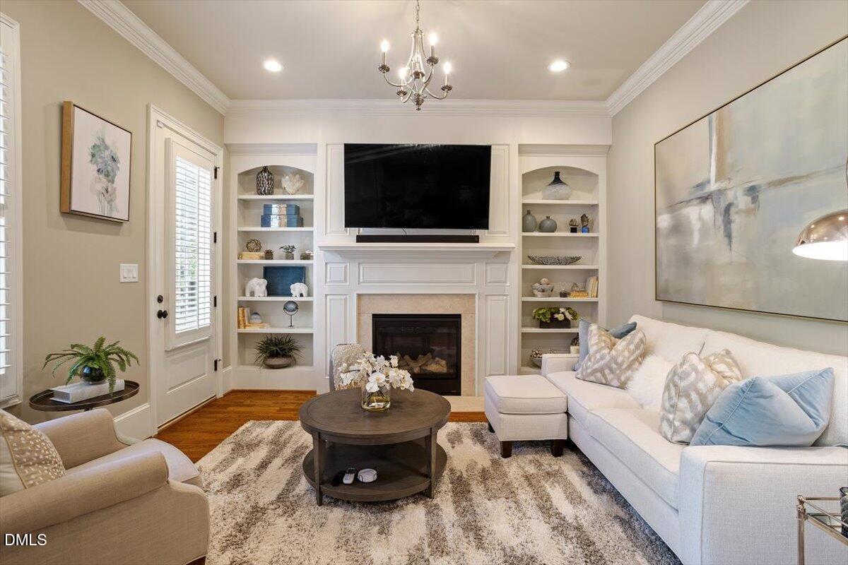 1413 Lily Estates Drive Raleigh, NC 27614 - Photo 23 of 82 a living room with furniture fireplace and a flat screen tv