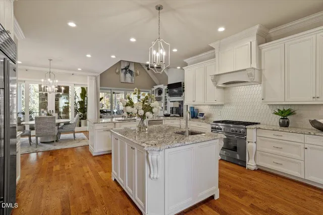 a living room with furniture and floor to ceiling windows