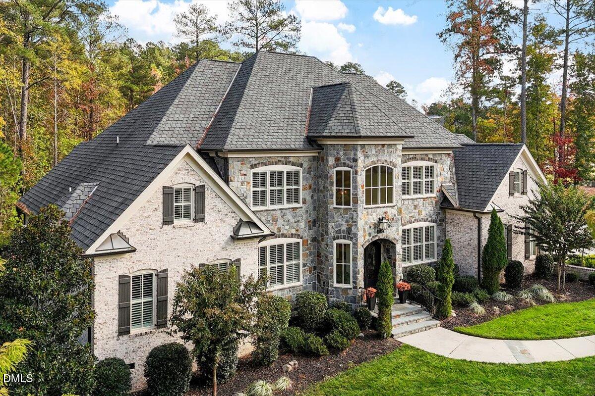 1413 Lily Estates Drive Raleigh, NC 27614 - Photo 2 of 82 a aerial view of a white house with a yard and potted plants