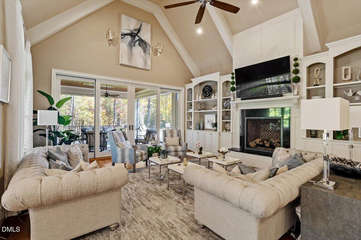 1413 Lily Estates Drive Raleigh, NC 27614 - Photo 34 of 82 a living room with fireplace furniture and a large window