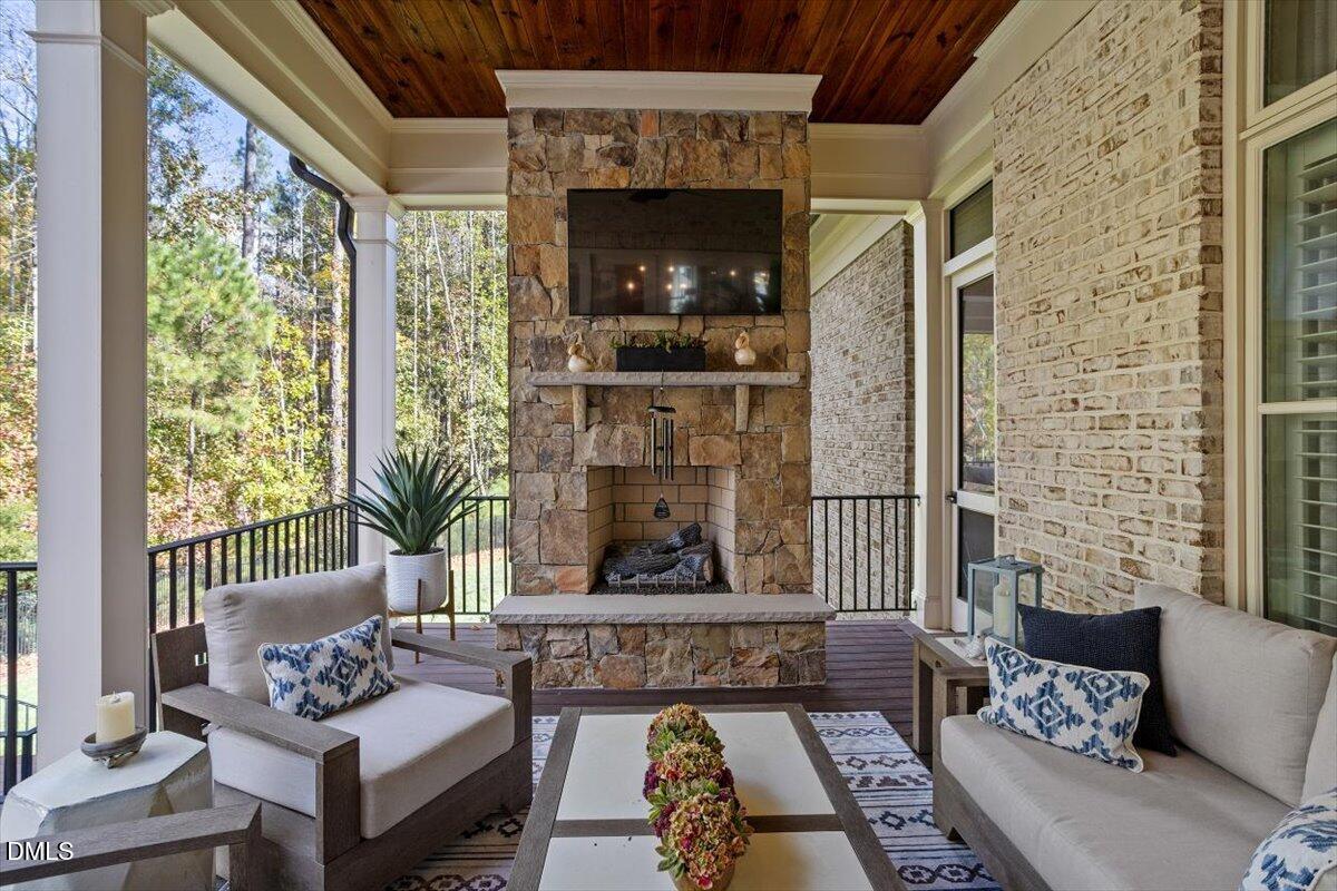 1413 Lily Estates Drive Raleigh, NC 27614 - Photo 40 of 82 a living room with furniture and a fireplace