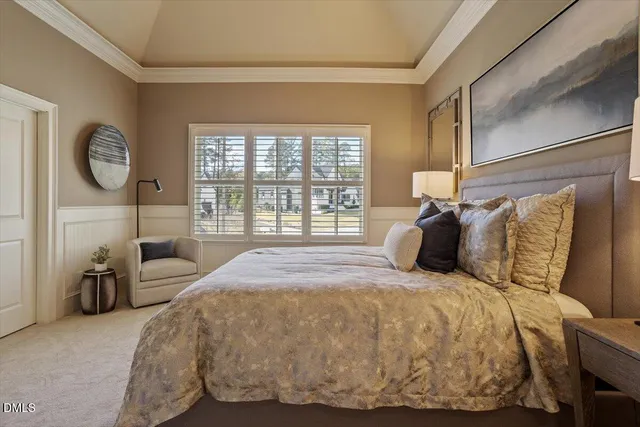 a view of a swimming pool with lawn chairs under an umbrella