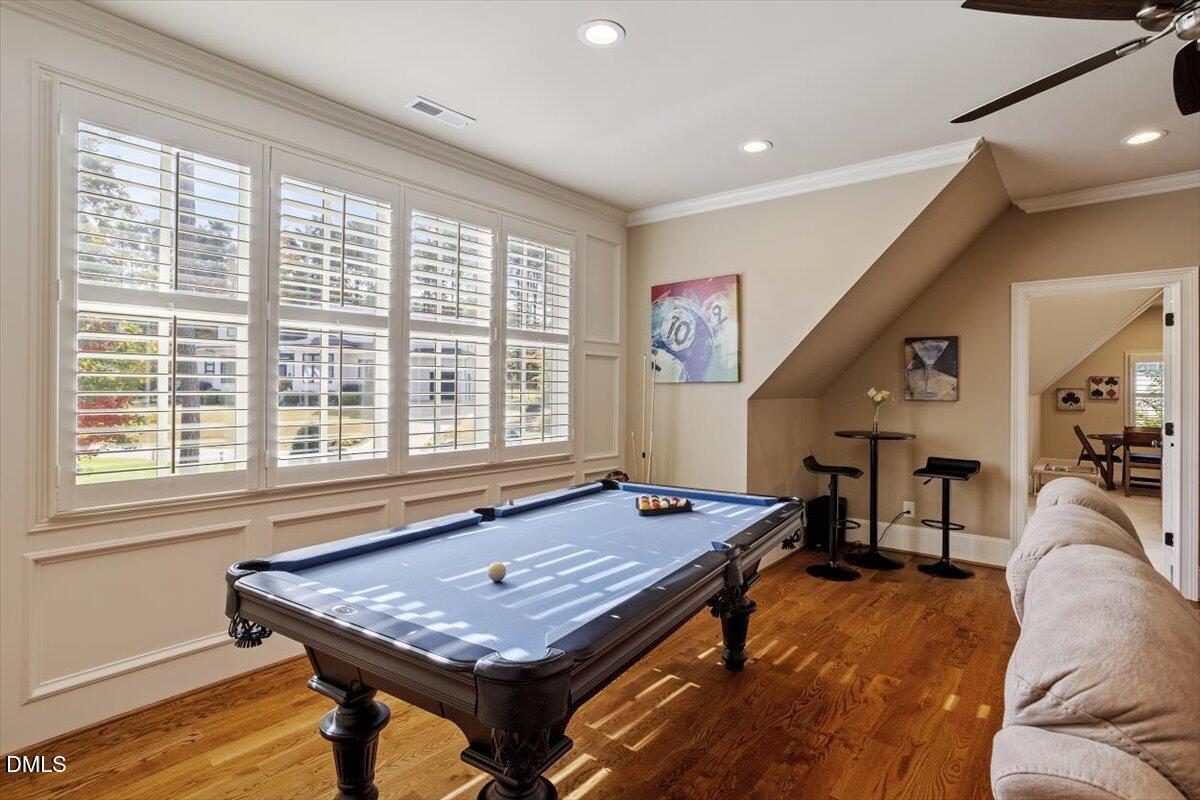 1413 Lily Estates Drive Raleigh, NC 27614 - Photo 52 of 82 a living room with furniture pool table and a large window