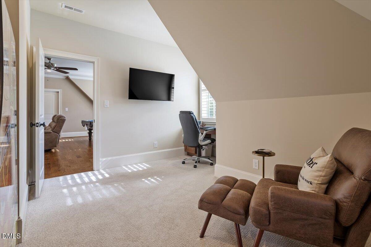 1413 Lily Estates Drive Raleigh, NC 27614 - Photo 53 of 82 a living room with furniture and a flat screen tv