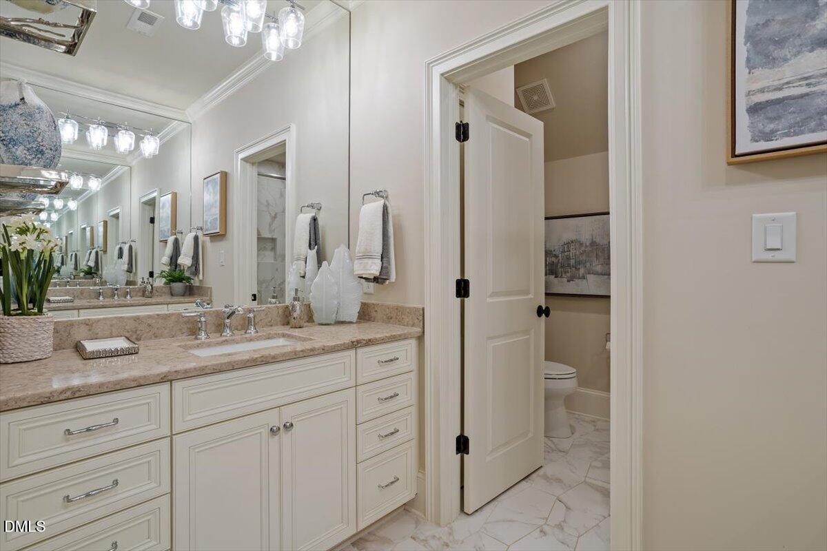 1413 Lily Estates Drive Raleigh, NC 27614 - Photo 58 of 82 a bathroom with a granite countertop sink mirror and shower